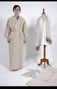 A collection of vintage early 20th century linens to include a gentlemans kimono style dressing