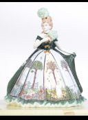 A large Coalport figurine complete in the box entitled Four Seasons - THe Millennium Ball being