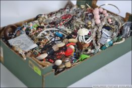 A large collection of assorted costume jewellery to include bracelets, bangles, necklaces etc.