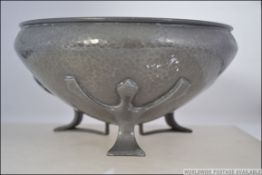 A circa 1907 believed Oliver Baker for Liberty's Tudric pewter bowl on three feet with cornelian