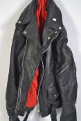 A vintage Rock N Roll Punk 1930's style black leather bikers jacket with red lining.