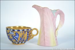 A 19th century small Royal Worcester jug together with a 19th century Coalport cup both pieces