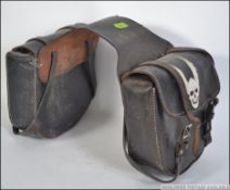 A set of vintage retro motorcycle leather panniers / saddle bags in black with the leather straps