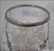 A 20th century glass vase having silver overlay.