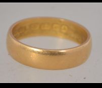 A hallmarked 22ct gold band ring. Hallmarked London. Maker Parsons. Size P. Weight 4.6g.