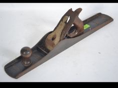 A 20th century large Stanley Bailey No 7 woodworking tool having wooden handle. See illustrations ).