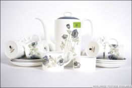 A Wedgwood bone china coffee service in the Susie Cooper design ' Evening Mist '.