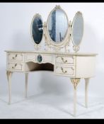 A 20th century French Louis Shabby Chic 16th style dressing table of kidney form raised on slender