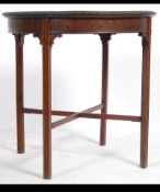 An Edwardian mahogany Chinese Chippendale occasional table raised on tapered legs with cross