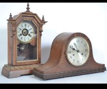 A 19th century Victorian gingerbread clock together with an oak 1930's dome top mantel clock with