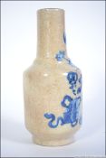 A Chinese blue and white Kang-xi crackle glaze vase with unsusual table and vase of flowers bearing
