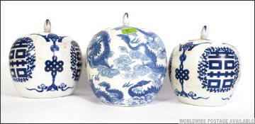3 Chinese blue and white Kang-xi ginger jars of pumpkin form having lids with finials to each.