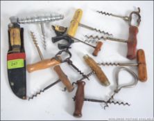 A good collection of early to middle 20th century corkscrews and bottle openers.