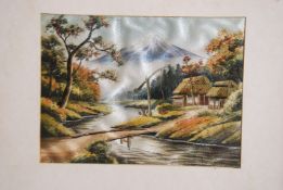 A 20th century Japanese framed needlepoint silk embroidered panel of Mount Fuji with river to the