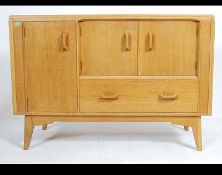 raised on tapering legs united by stretchers.