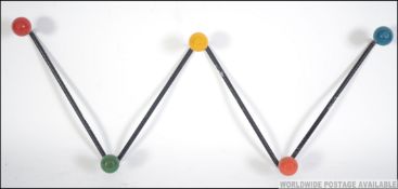 A vintage retro atomic sputnik style set of coat hooks. Measures: 49cms wide.