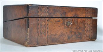 A 19th century Victorian walnut tunbridge inlaid writing slope having an appointed interior to