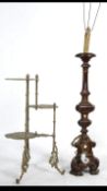 A mid century brass rococo stand having multiple tiers with shaped rococo supports together with a