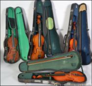 A mixed lot of 4 violins- musical instruments.