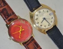 A 1980's Raketa Russian red face wristwatch with decorative hammer and sickle hands on leather