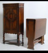 A 1920's Jacobean corner cabinet on stand.