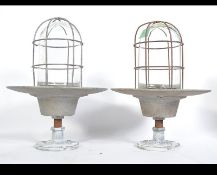 A pair of mid century Industrial bulkhead lights with saucer bases,