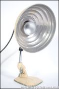 A vintage Pifco mid century industrial infra red heat lamp,