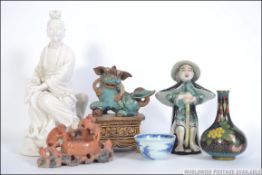 A collection of Chinese and Japanese items to include figures, tea bowl,