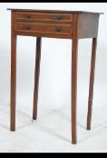 A 19th century Georgian mahogany inlaid side table raised on square tapered legs with bank of