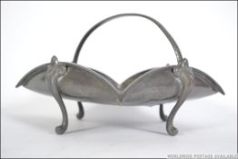 A vintage 20th century hammered English pewter twin handled tazza / fruit bowl. Stamped to the base.