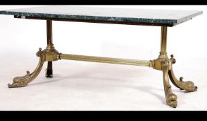 A mid 20th century ornate rococo coffee table with a rectangular marble top on a brass base,