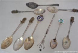 A collection of teaspoons the first a silver plate and enamel spoon for The Blue Funnel Line,