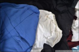 A group of vintage scholar gowns to include blue and black with Mortar boards