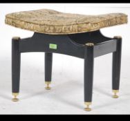 A mid century G-Plan upholstered dressing table stool raised on tapered supports with overstuffed