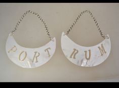 A pair of decorative contemporary mother of pearl wine - decanter labels,