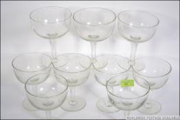 A good set of 20th century glass ice cream bowls raised on single stems with terraced bases.