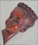 An unusual German Achatit ceramic wall mask, numbered 1219. Measures: 17cms high.