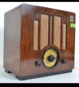 A 1930's Art Deco KB radio dating to 1939 believed model KB381 set to a walnut case with decorative