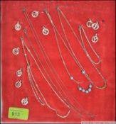 A collection of silver 925 and white metal ladies necklaces along with a group of white metal