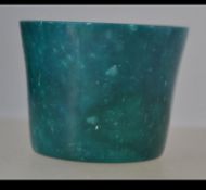 An unuusual Chinese green Jade brush pot of cylindrical tapering form