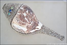 A Chinese Tibetan silver mounted conch shell.