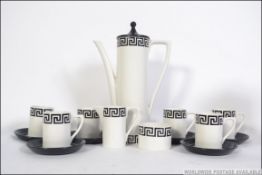 A retro 20th century Portmeirion coffee service for six in the Greek key pattern on a white back