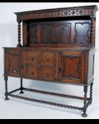 A 1930's Jacobean revival oak barley twist sideboard dresser.