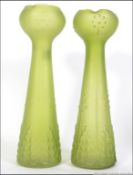 A pair of oversized green glass hyacynth vases in the manner of Loetz. Measures: 32cms high.