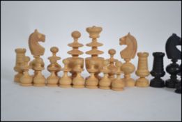An ebony and boxwood chess set of unusual form in the manner of William Lund,