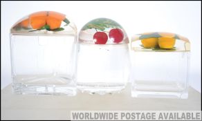 A group of three stunning vintage / retro chintzy 20th century lidded acrylic preserve pots each