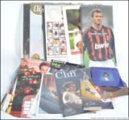 A collection of Cliff Richard calendars and records dating from the 20th century