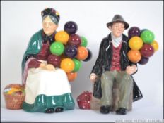 Two Royal Doulton figures, The Balloon Man HN 1954, The Old Balloon Seller HN 1315.