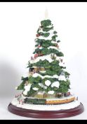 A contemporary illuminated Christmas tree ornament titled ' Home For Christmas ' in the form of a