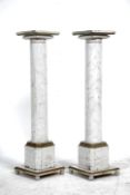 A pair of decorative faux marble column - plinth bust stands.